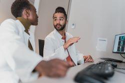 two doctors in a room talking